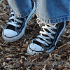 chuck taylors suit my older son so well.  he looks so cool in them (these are  his second pair-his feet are growing so fast!) of course, he's got red socks on too.  always red socks even when they don't match everything else he's wearing.  the boy loves red.