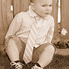my little guy 'bonked his bean' (graff lingo for "hit his head") this morning awfully hard on the toybox.  he got over it very quickly but i was thinking that the black and blue spot on his forehead might not look too well for his birthday on sunday. so--i raced to dress him in his birthday portrait outfit and urged him to pose for me.  it was a struggle for us both but i think i got a couple of cute ones.
(thanks john for offering feedback and helping me to pick these out of the album.)  
happy early birthday my love.  sorry-but momma is probably going to dress you up for a few years to come--until you are able to put up a fight!
more here:
http://graffs.smugmug.com/gallery/5253917_FWefQ#319560566_ux7Uq